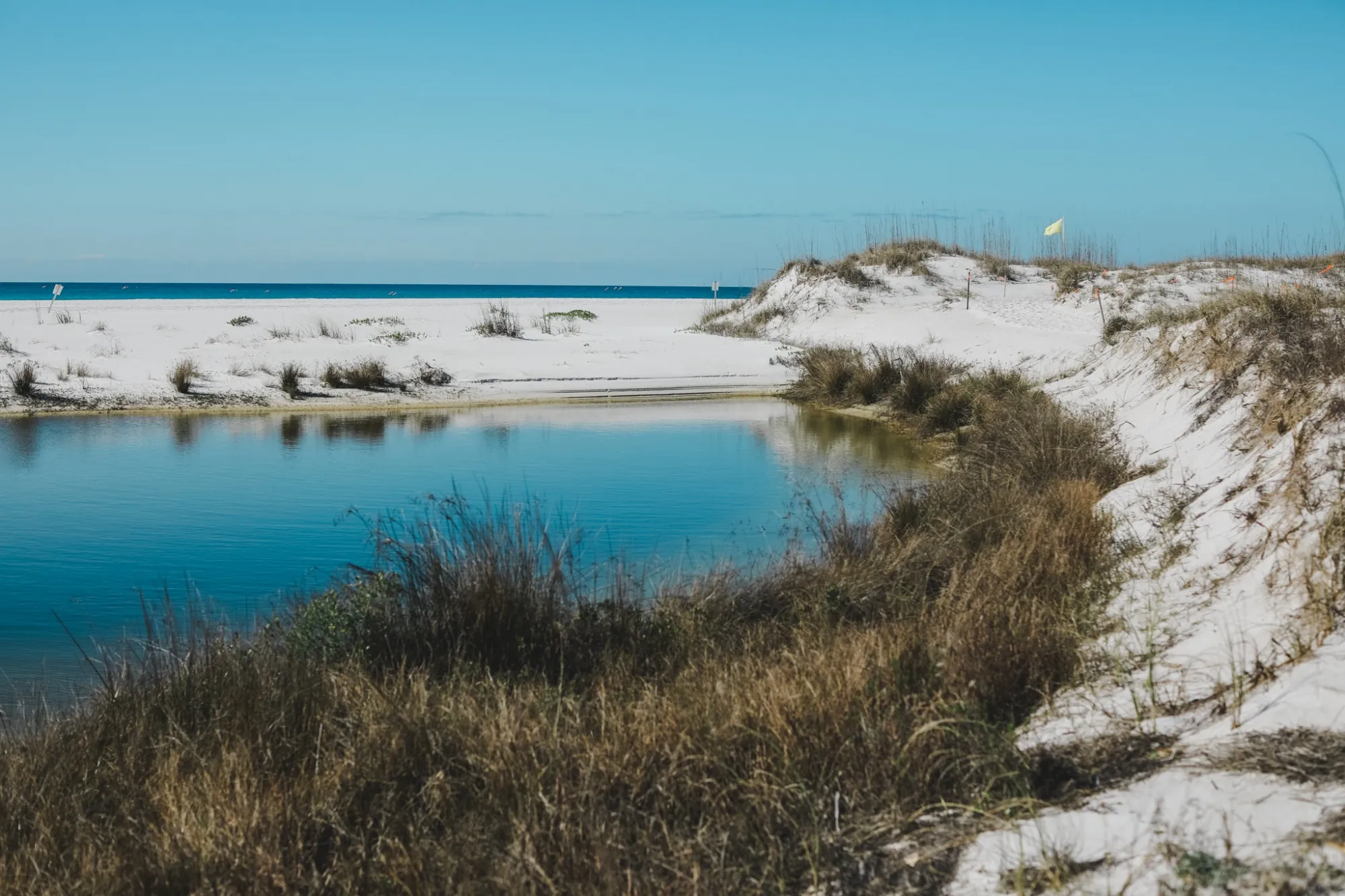 Dune lake opening toward the Gulf along Scenic Highway 30A